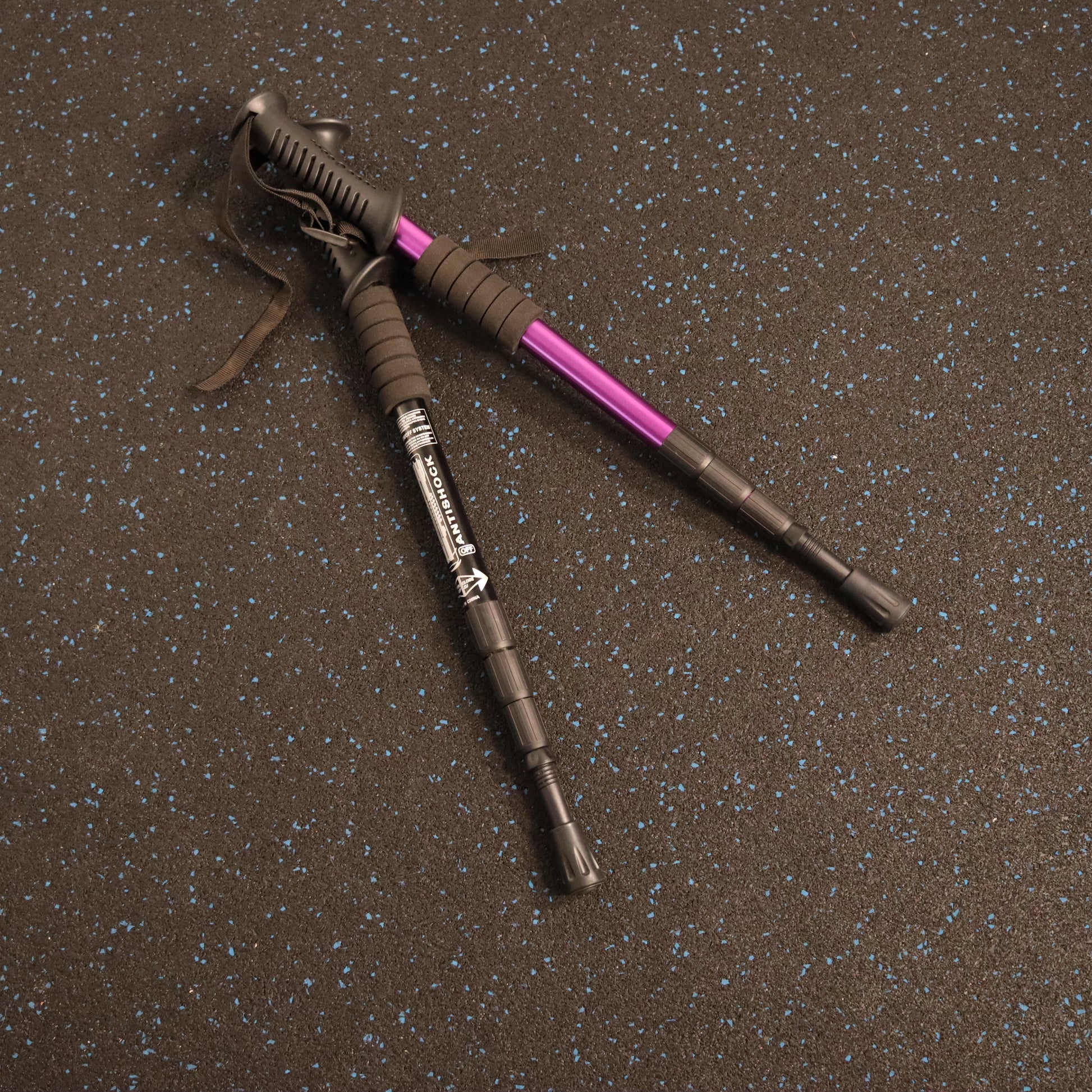 A pair of Strexi Stix, one with black and one with purple color accents.